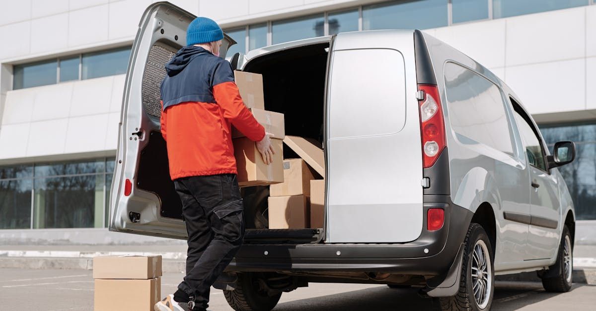 guy moving stuff into van