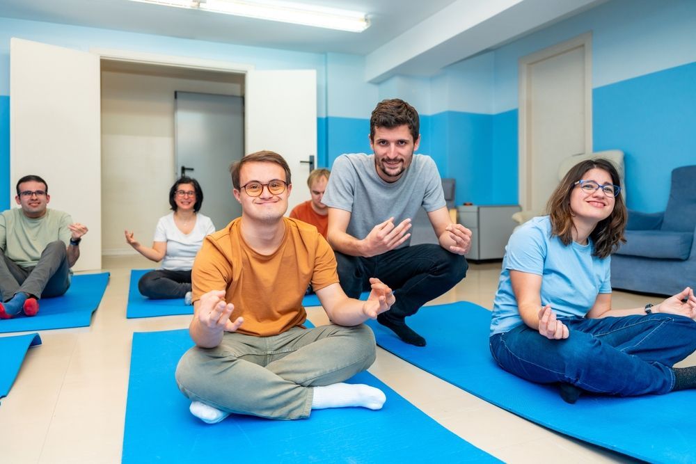 People on Blue Yoga Having a Fitness Session — Active Ables Community Services In Brookwater, QLD