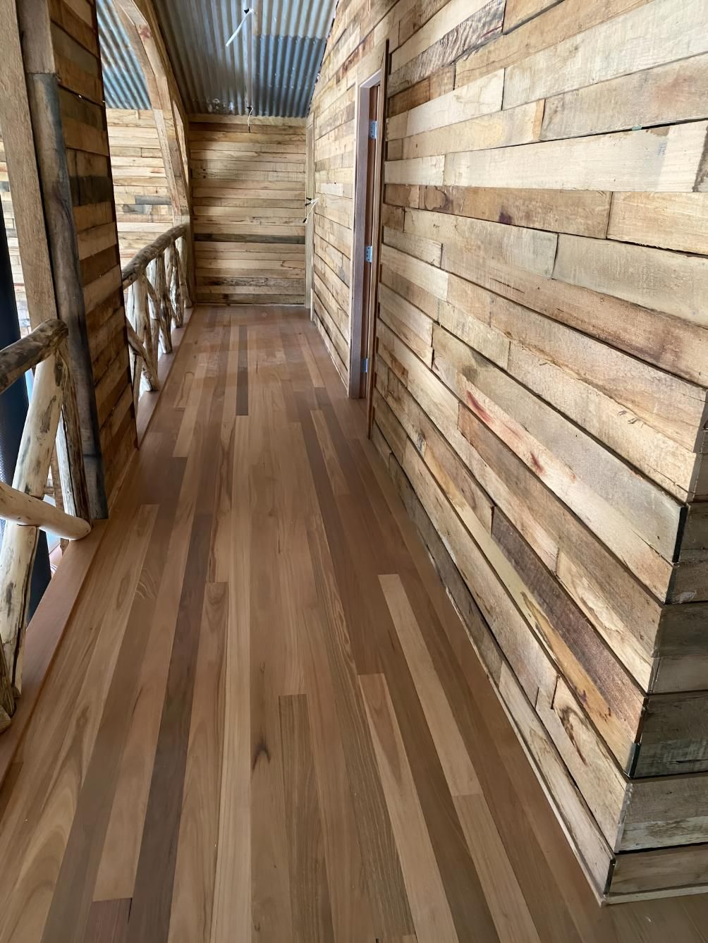 A Hallway With Wooden Walls And Floors In A Cabin โ Coolangatta Floor Sanding In Shoalhaven Heads, NSW