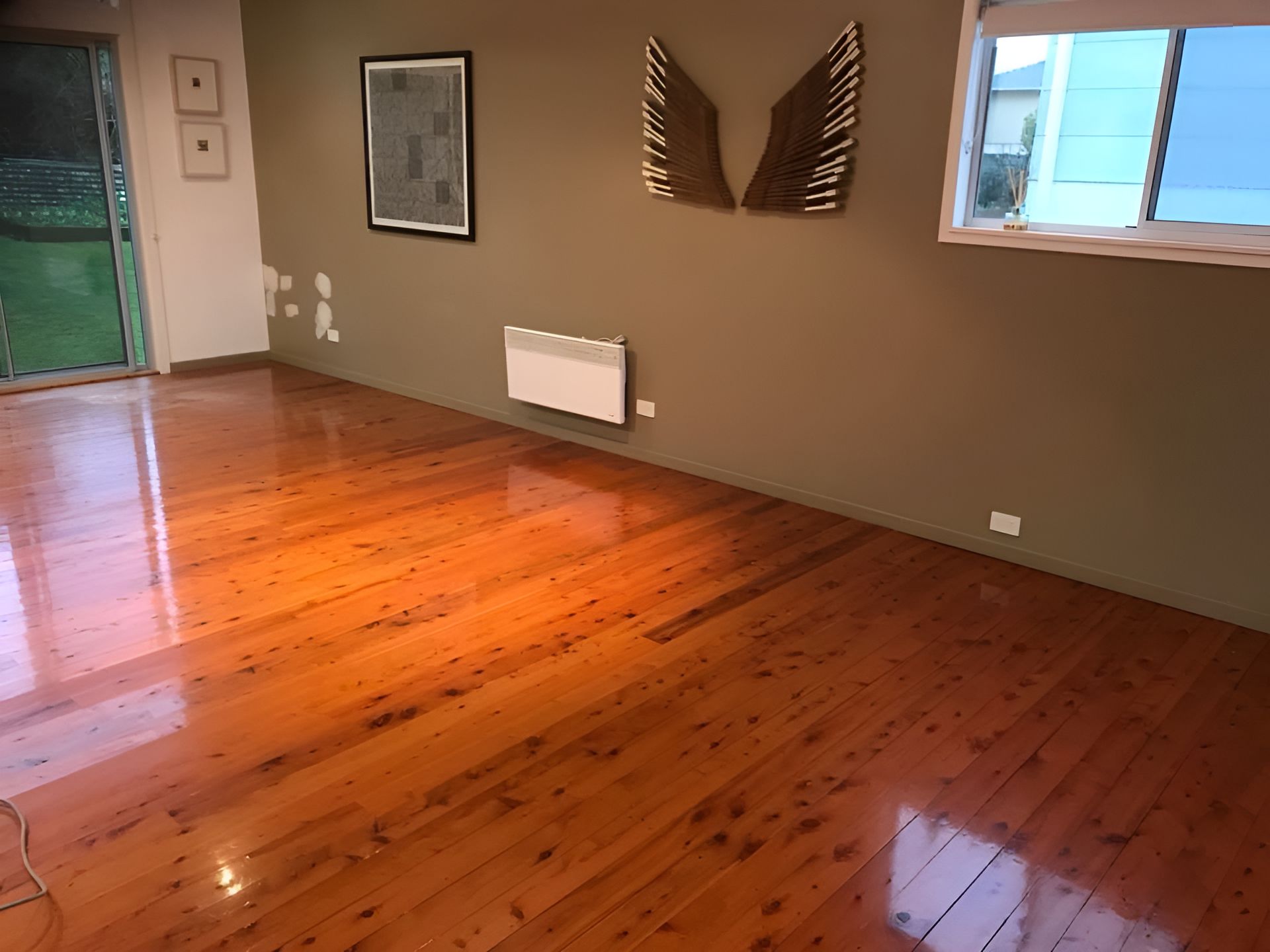 A Living Room With A Wooden Floor And A Window โ Coolangatta Floor Sanding In Shoalhaven Heads, NSW