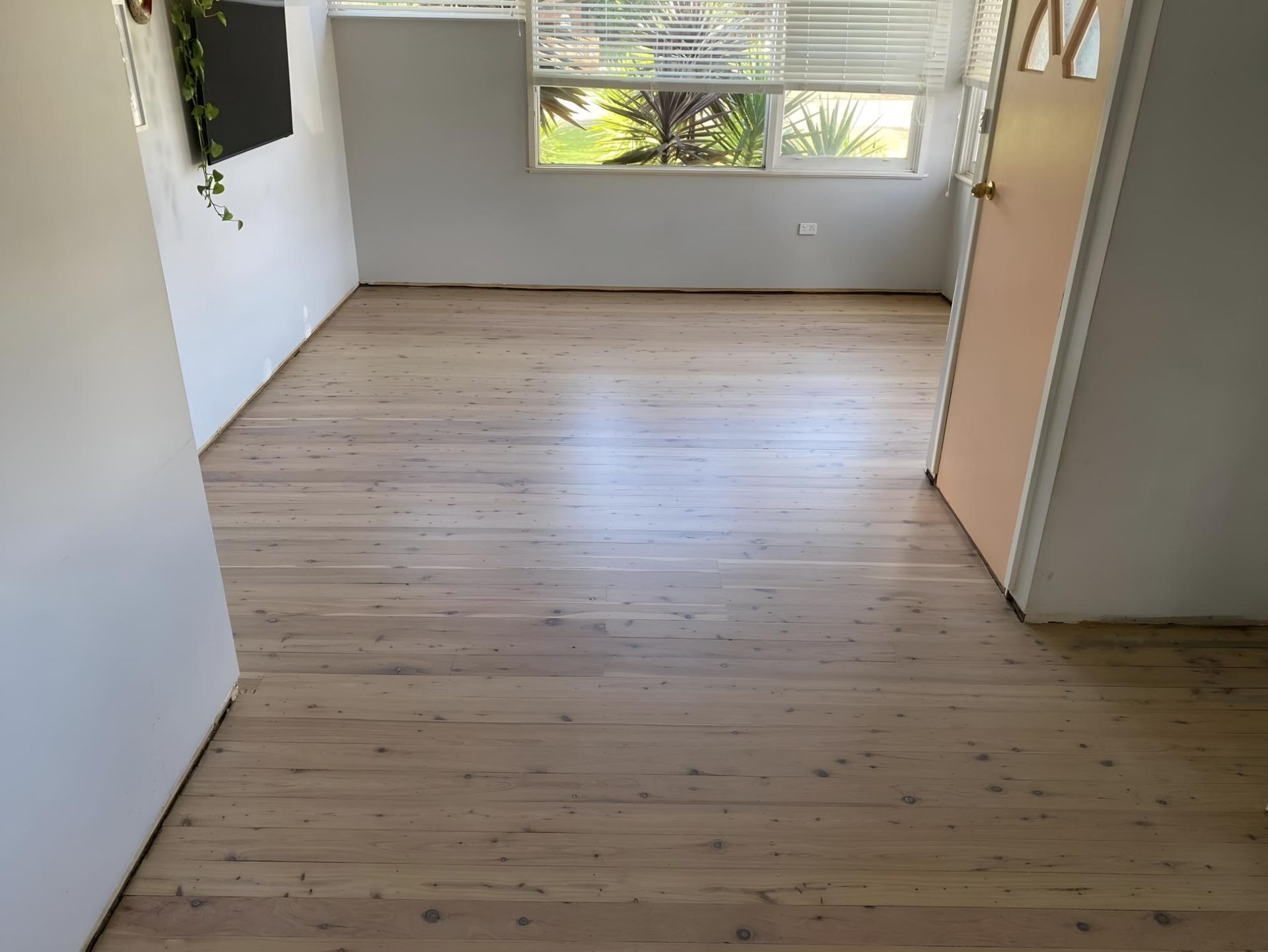 An Empty Room With A Wooden Floor And A Window โ Coolangatta Floor Sanding In Shoalhaven Heads, NSW