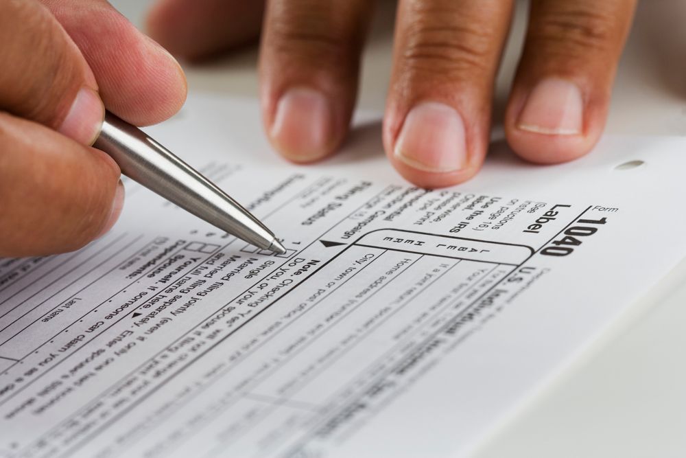 Tax professional providing financial advice to a small business owner