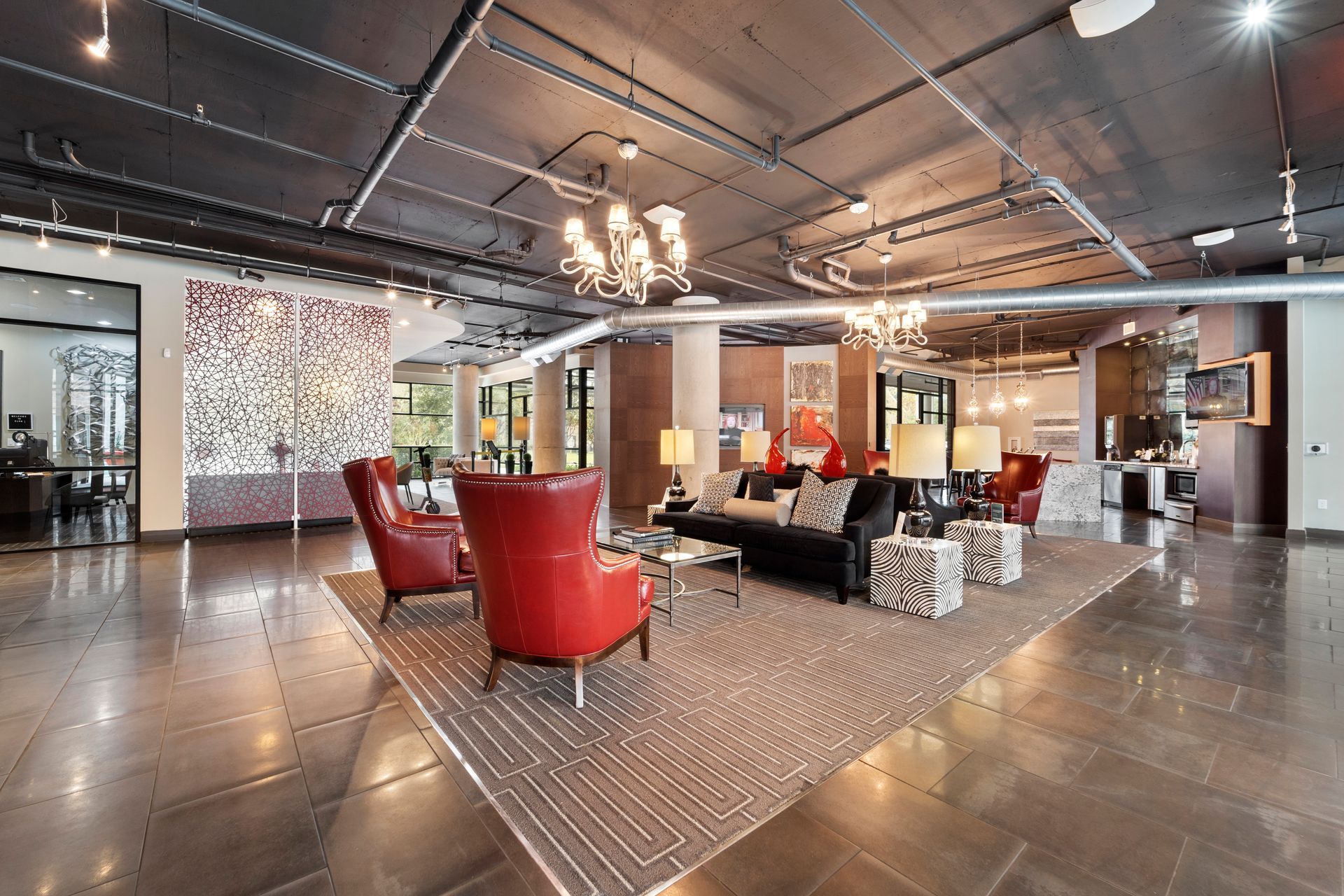 A large living room with a lot of furniture and a chandelier.