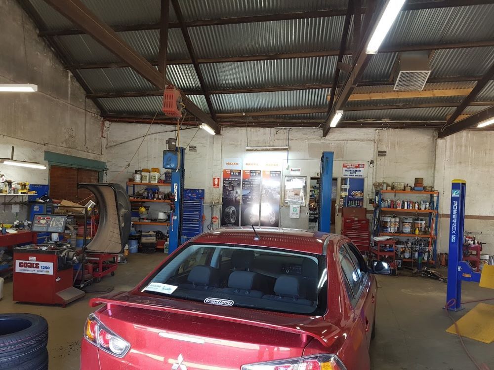 A Red Car is Parked Inside of a Garage — Mayne Street Auto in Gulgong, NSW