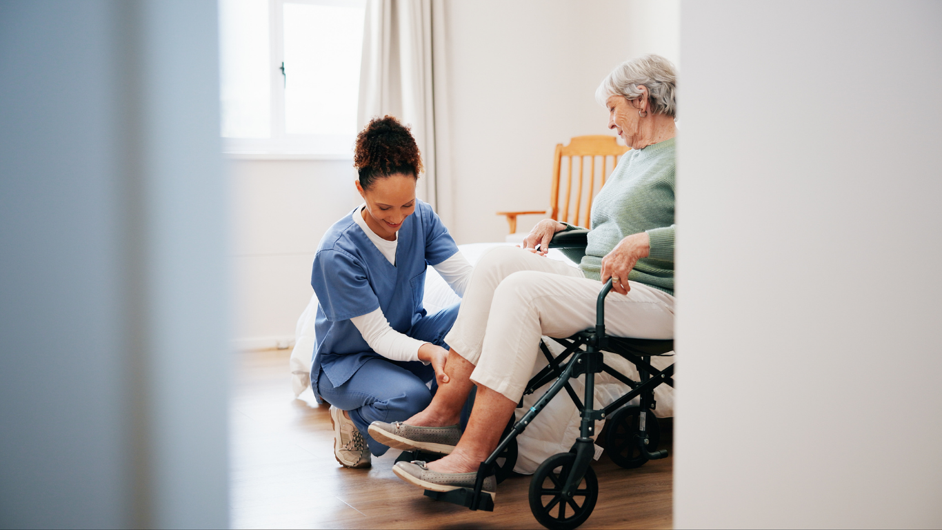 Nurse assisting an elderly patient with a walker in a bright living room