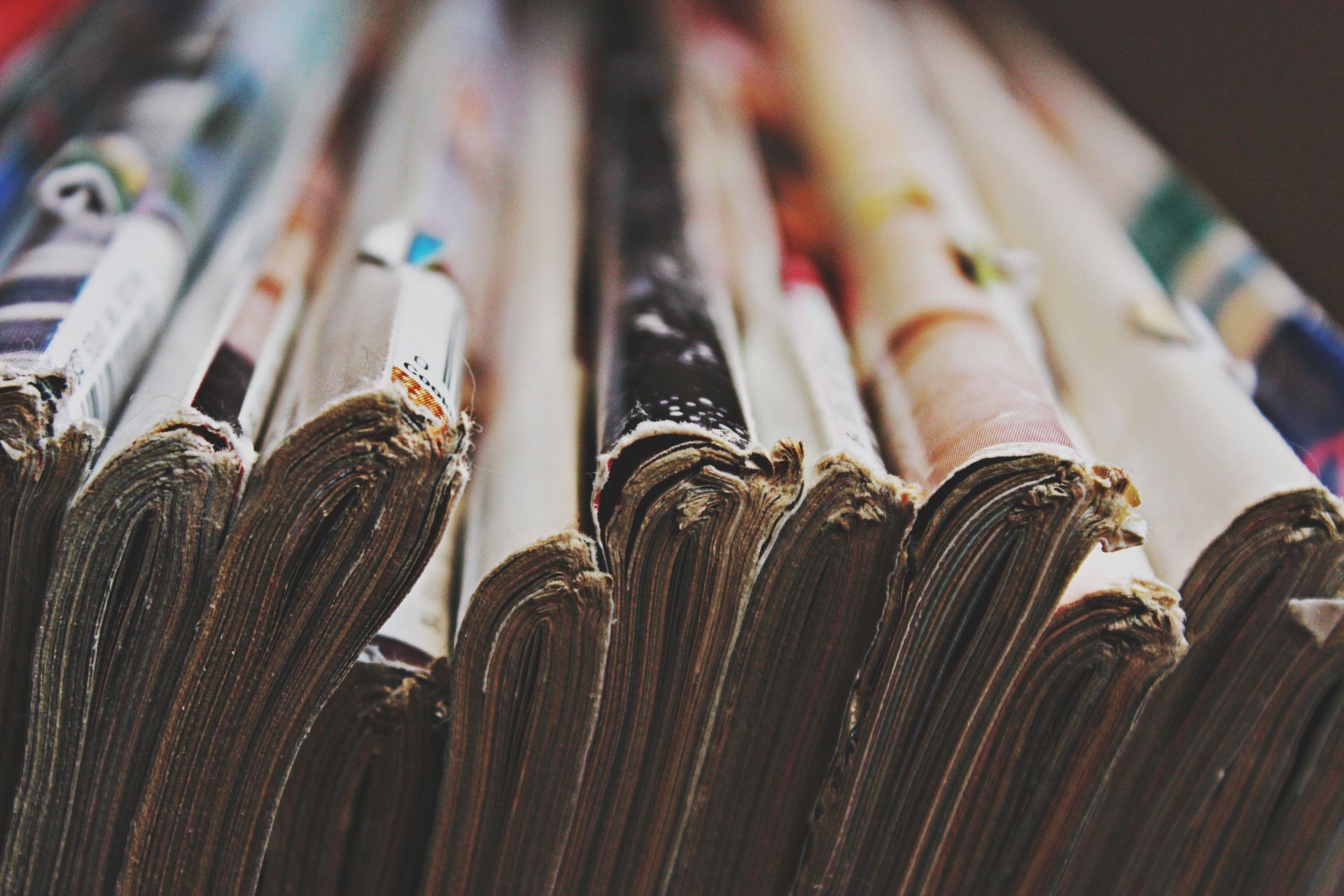 Stacks of rolled newspapers or magazines in a close-up view