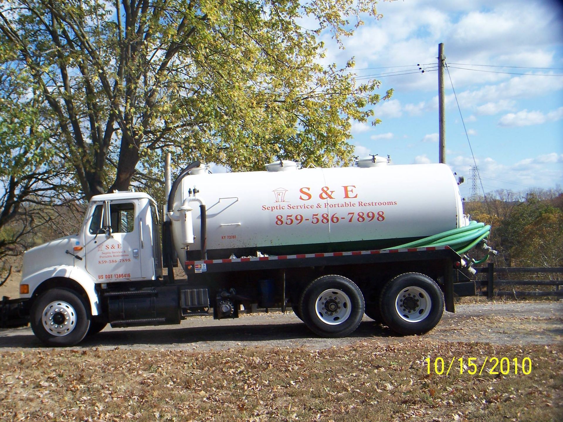 A s & e vacuum truck is parked on the side of the road
