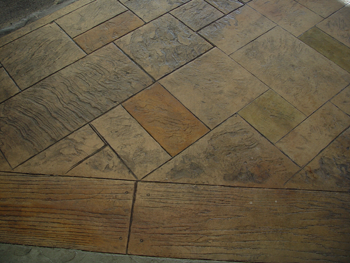 A close up of a tiled floor that looks like wood