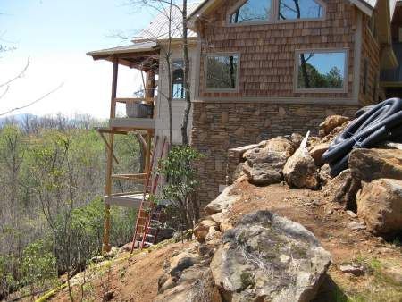 building a custom home on a slope in the mountains featherstone