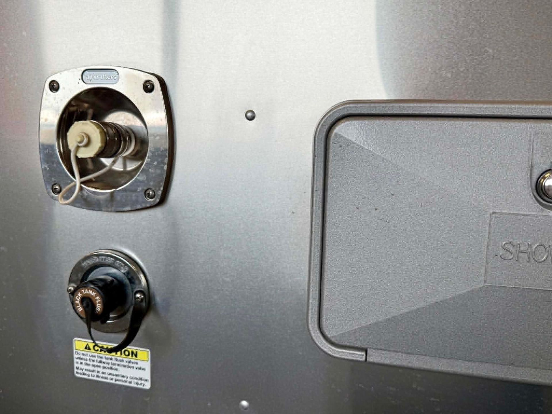 Picture of the water inlet on an Airstream trailer showing Airkrafters nLET City Water Inlet
