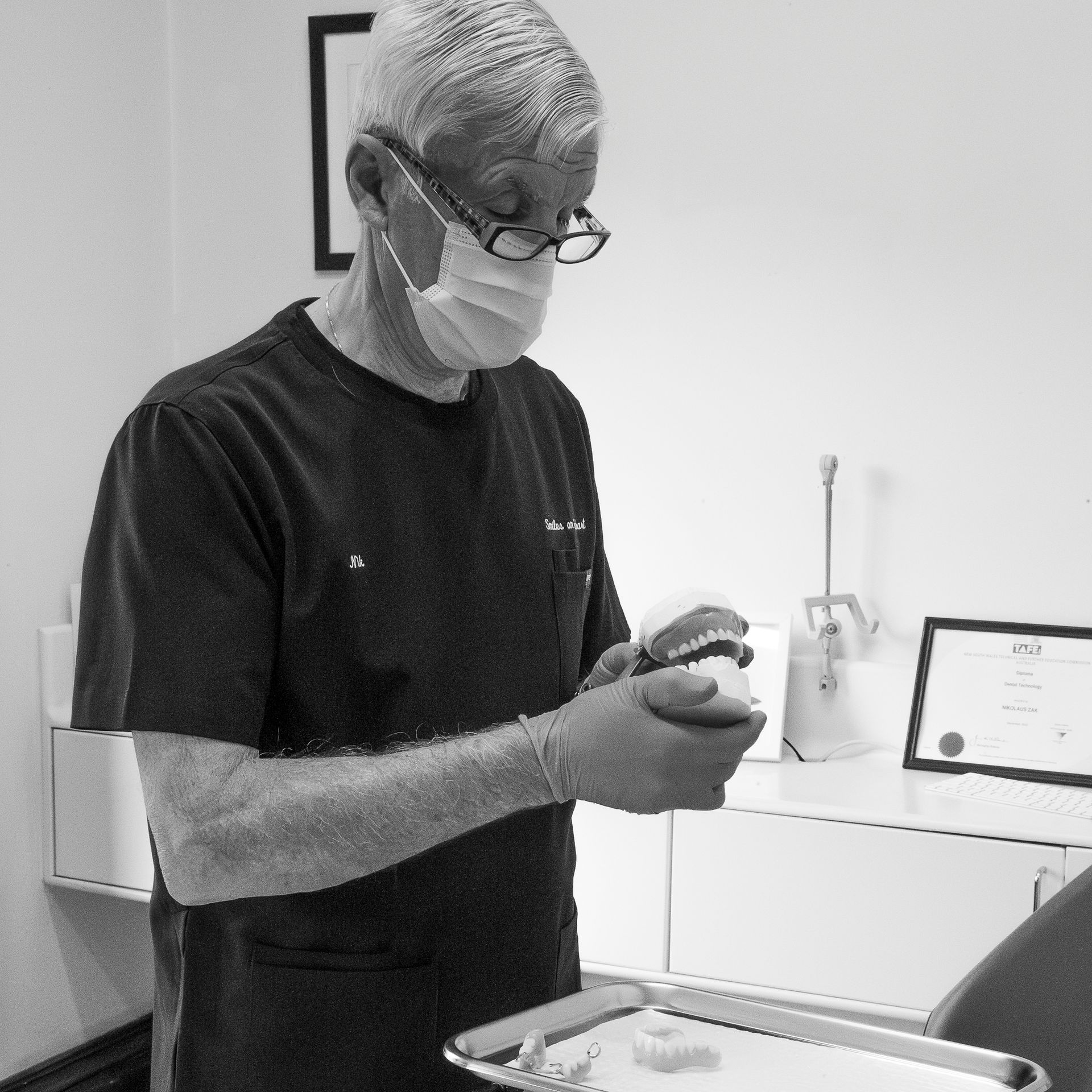 Man in Black Scrubs and Mask Holding — Smiles On Hobart in Hobart, TAS
