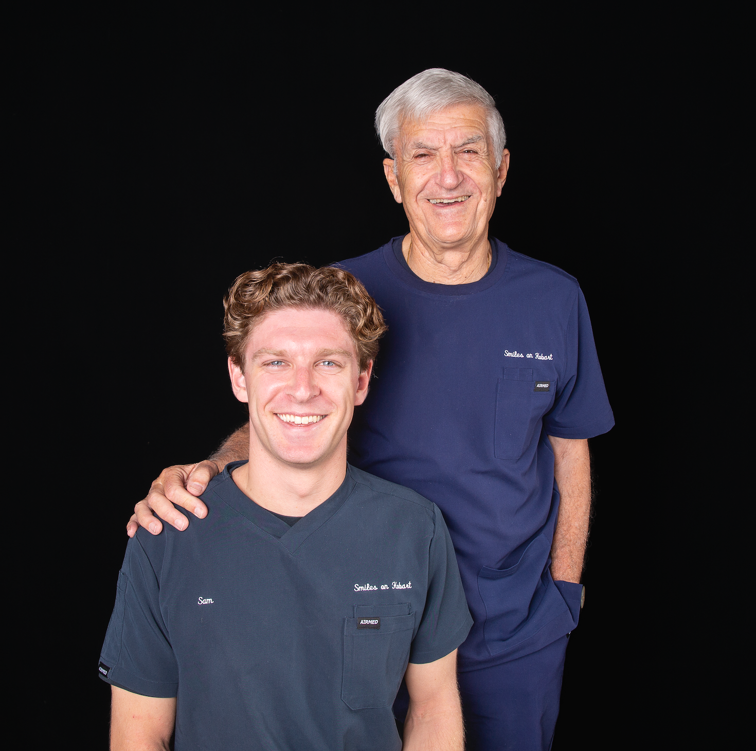 Two Smiling People in Navy Shirts — Smiles On Hobart in Hobart, TAS