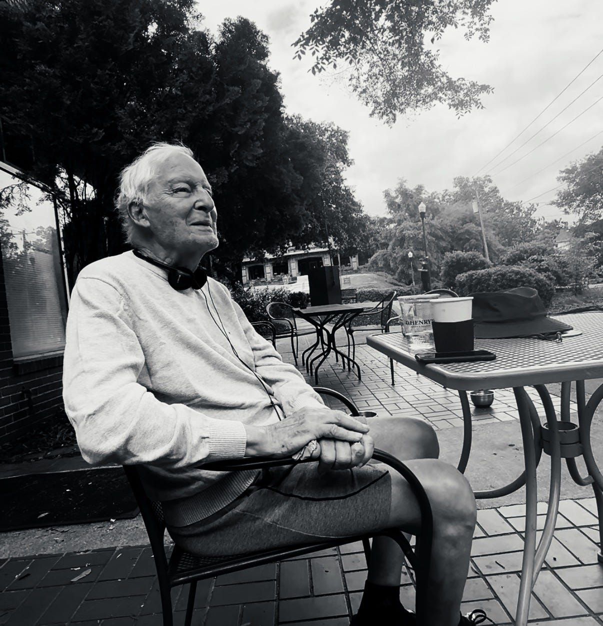 Black and white photo of Mario sitting outside