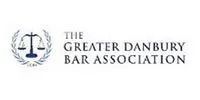 Logo for The Greater Danbury Bar Association, featuring scales of justice within a laurel wreath.