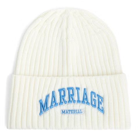 White knit beanie with blue “MARRIAGE” embroidery and small “MATERIAL” text