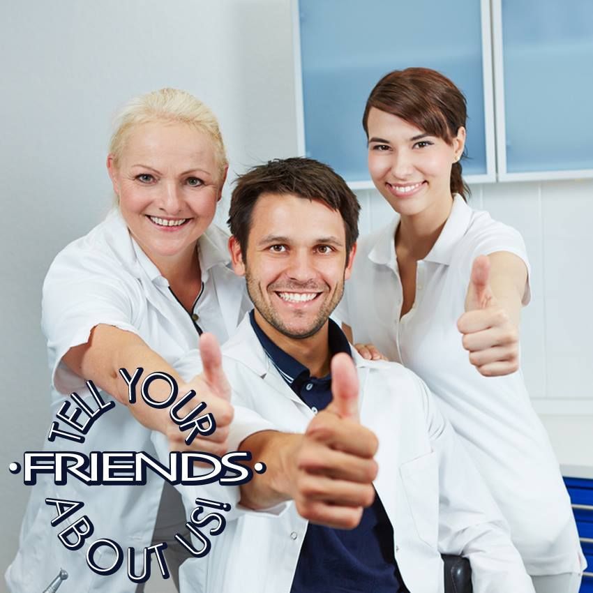 Three medical professionals smiling with thumbs up in an office setting. Three medical professionals smiling with thumbs up in an office setting.