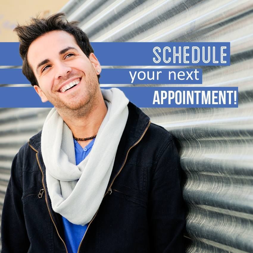 Smiling person leaning against metal wall; text says Schedule your next appointment! Smiling person leaning against metal wall; text says Schedule your next appointment!