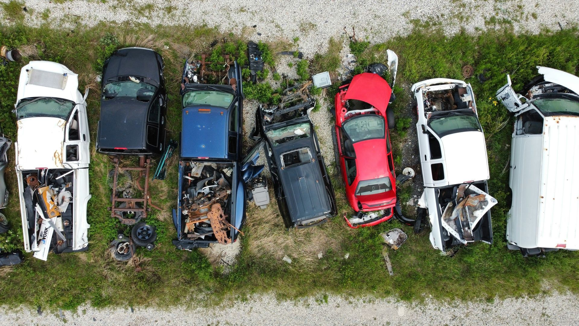 Vehicles to remove and haul Old vehicles being prepared to haul off of a premise. Let Helena Junk Hauling remove your junk today.