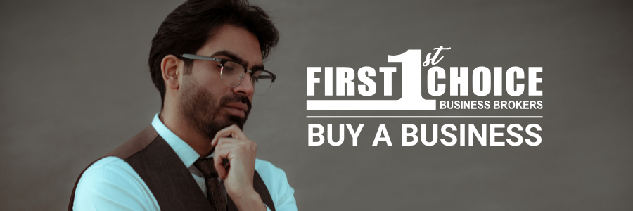 A man in a suit and tie is standing in front of a sign that says first choice buy a business