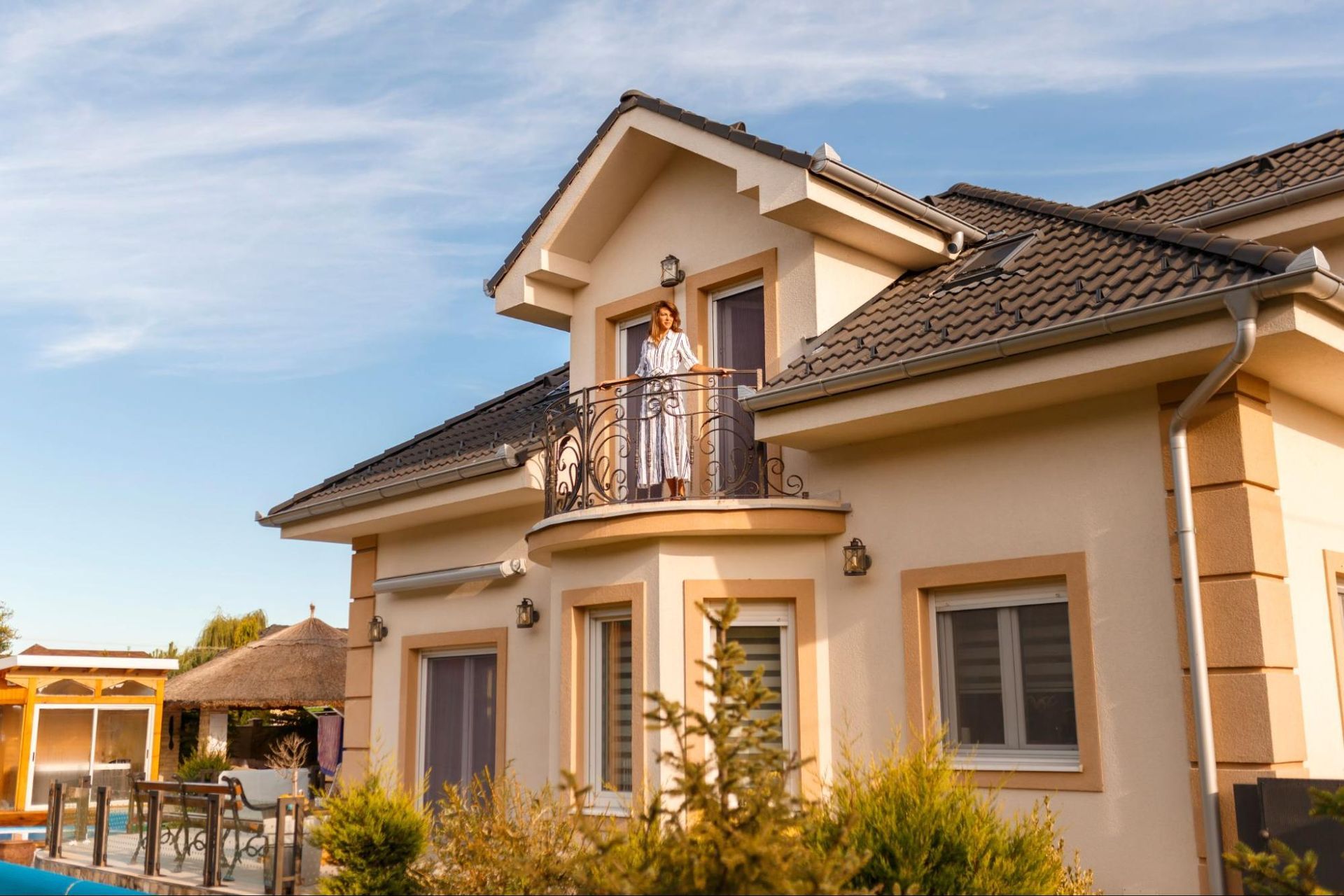 woman in house with balcony