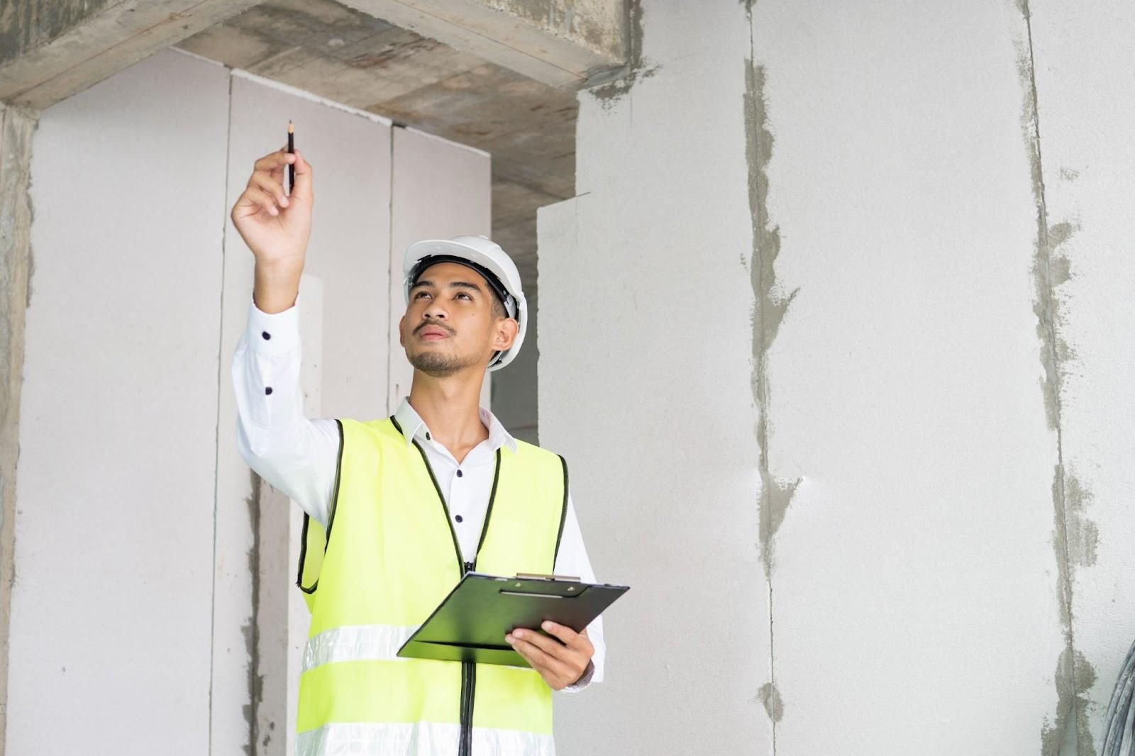 Licensed home inspector assessing Houston-specific risks including foundation movement, moisture, termites, roof wear, and drainage issues