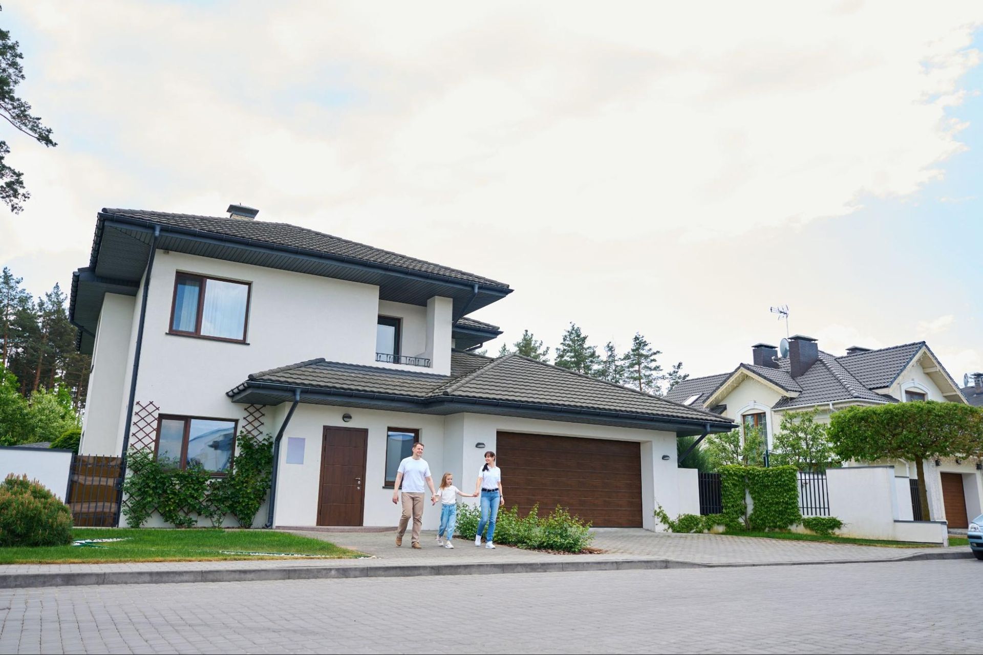 family in front of house