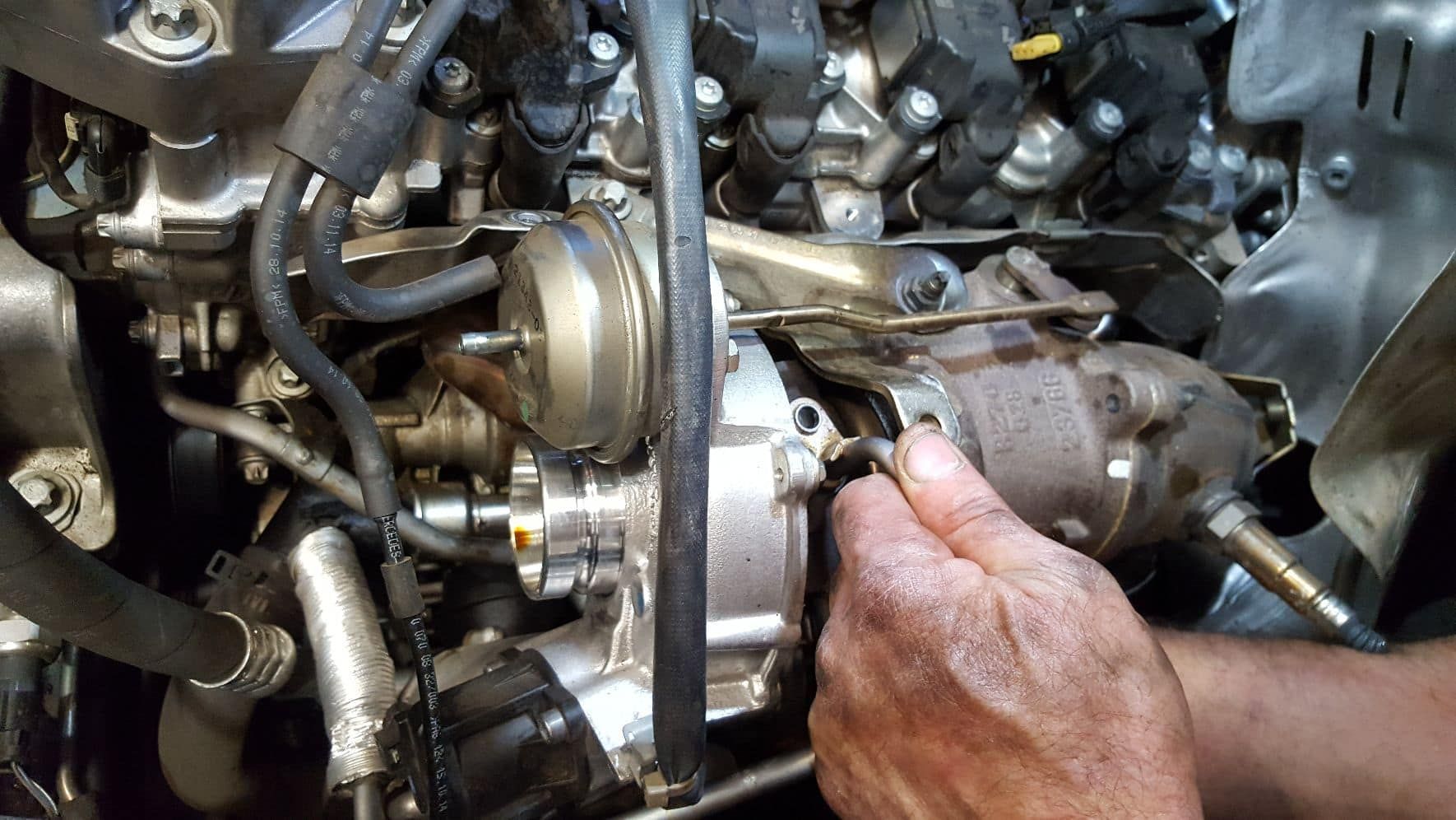 Mechanic Working on Underside of Car — Auto Repair Services in Picton, NSW