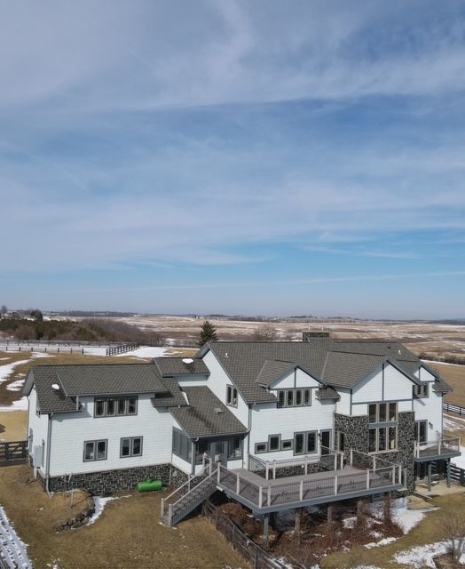 A white roof with a few buildings in the background