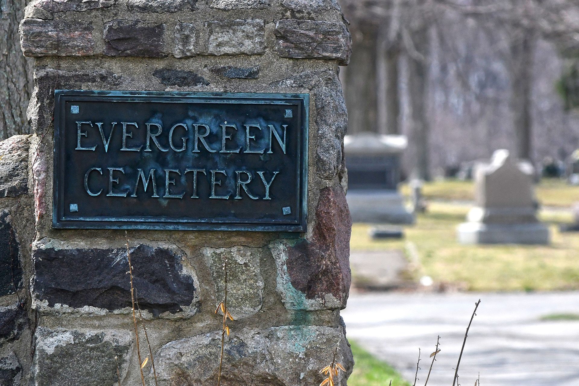 Stone pillar with bronze sign: 