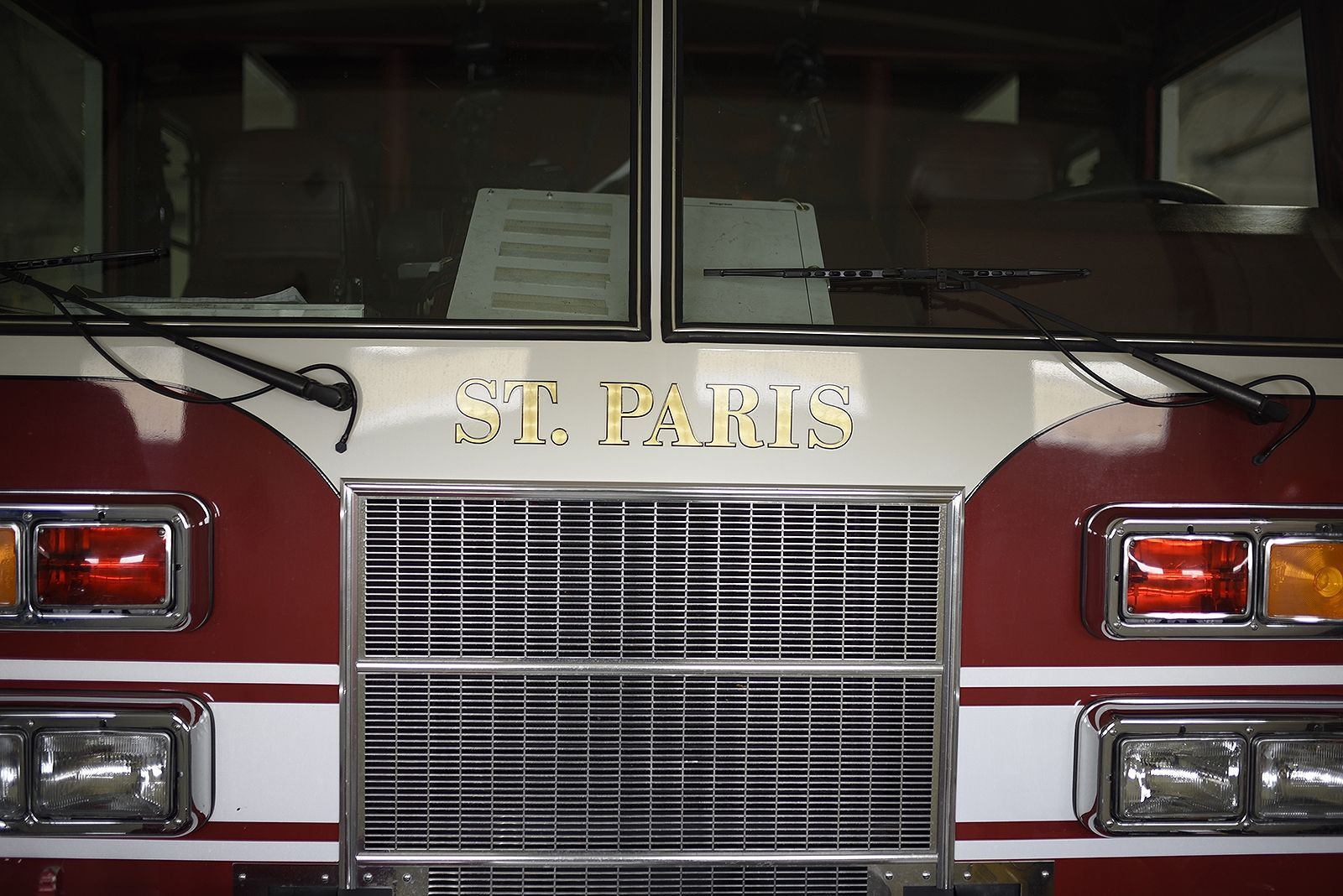 Red and white fire truck front with