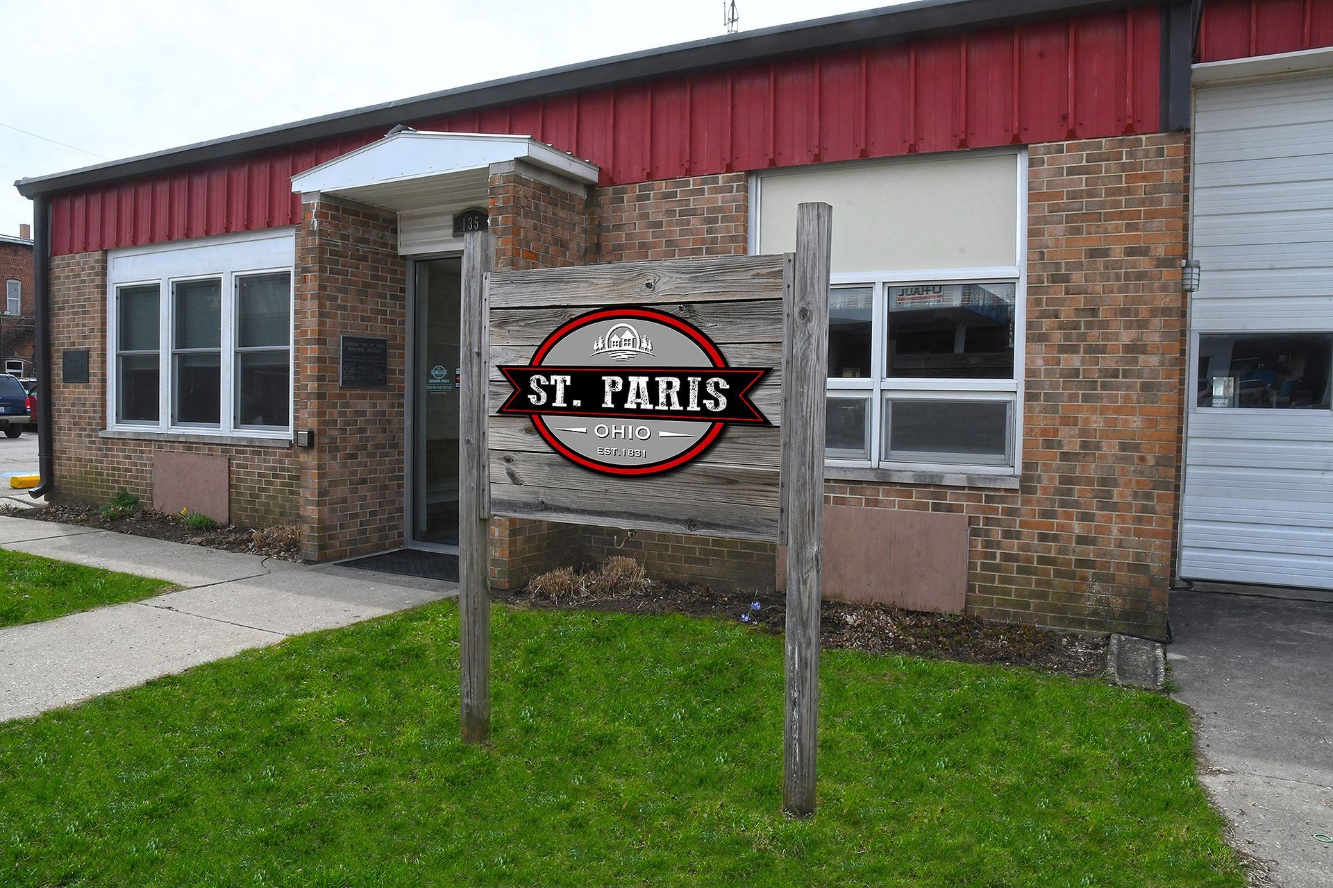 Sign outside a brick building reading