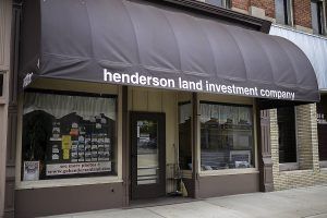 Henderson Land Investment Company storefront with awning.