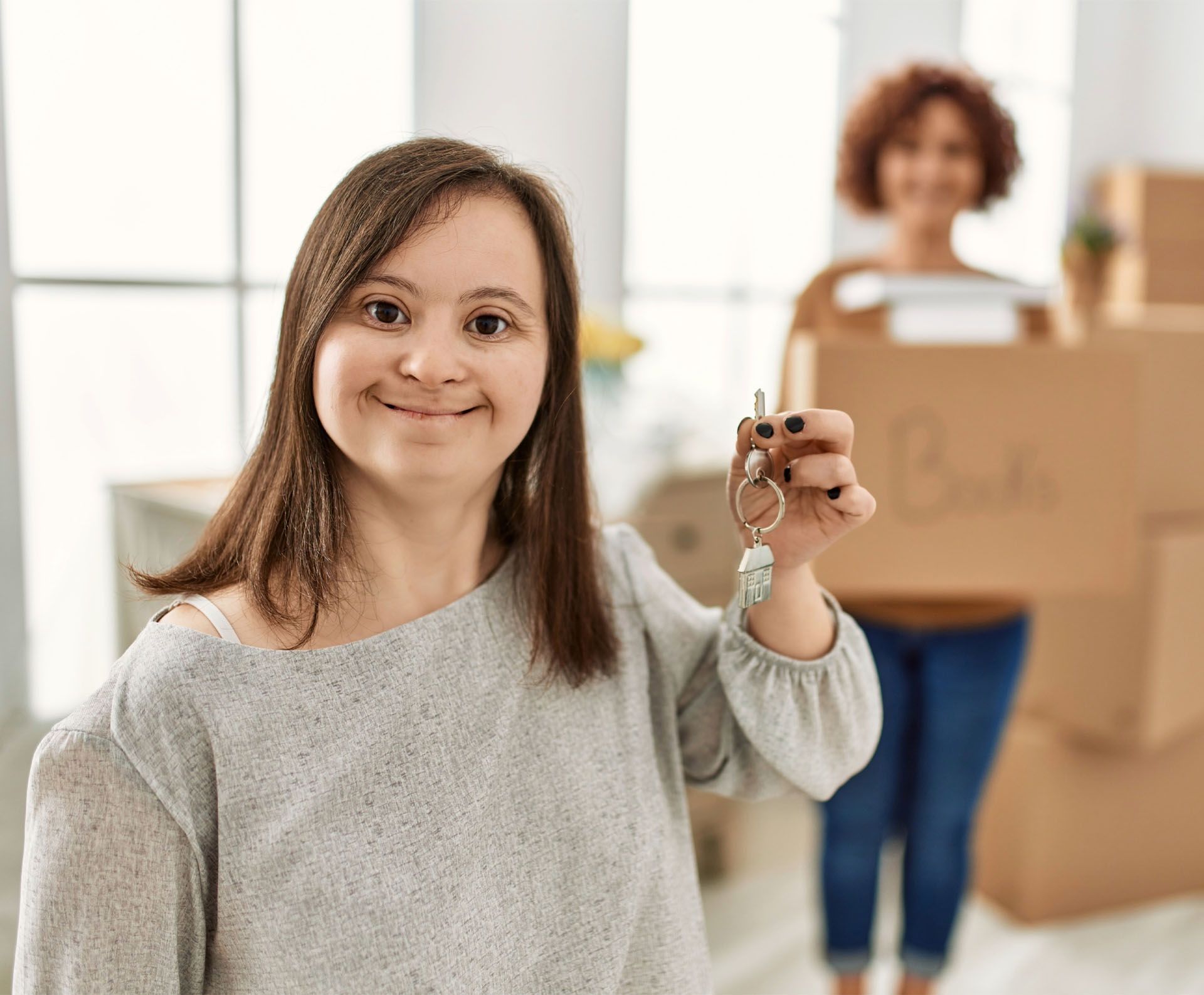 a woman holding a key