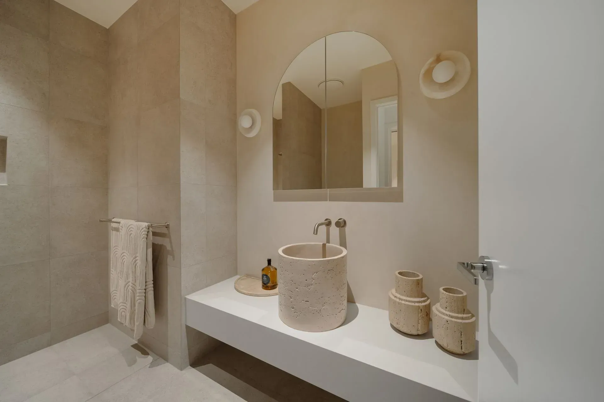 A Bathroom With A Sink, Mirror, And Towels — Reynolds Built In Moffat Beach, QLD