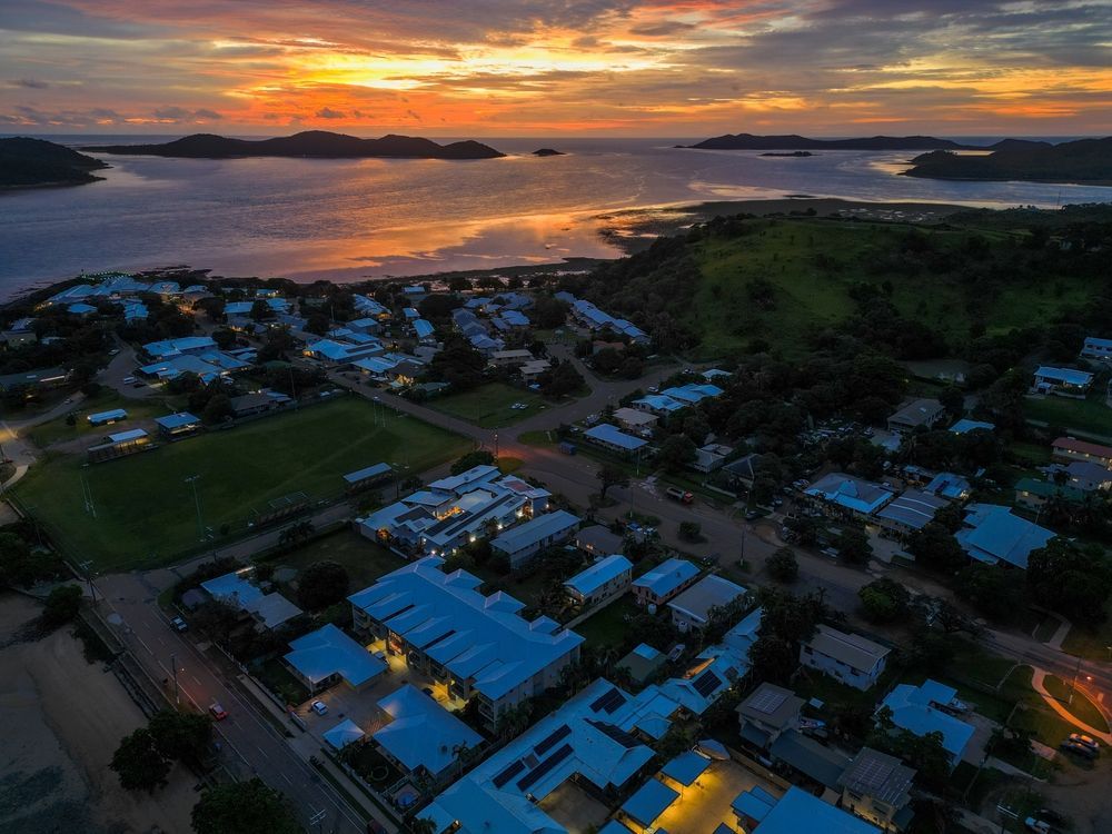 An Aerial View of a Coastal Town at Sunset — Reynolds Built In Currimundi, QLD
