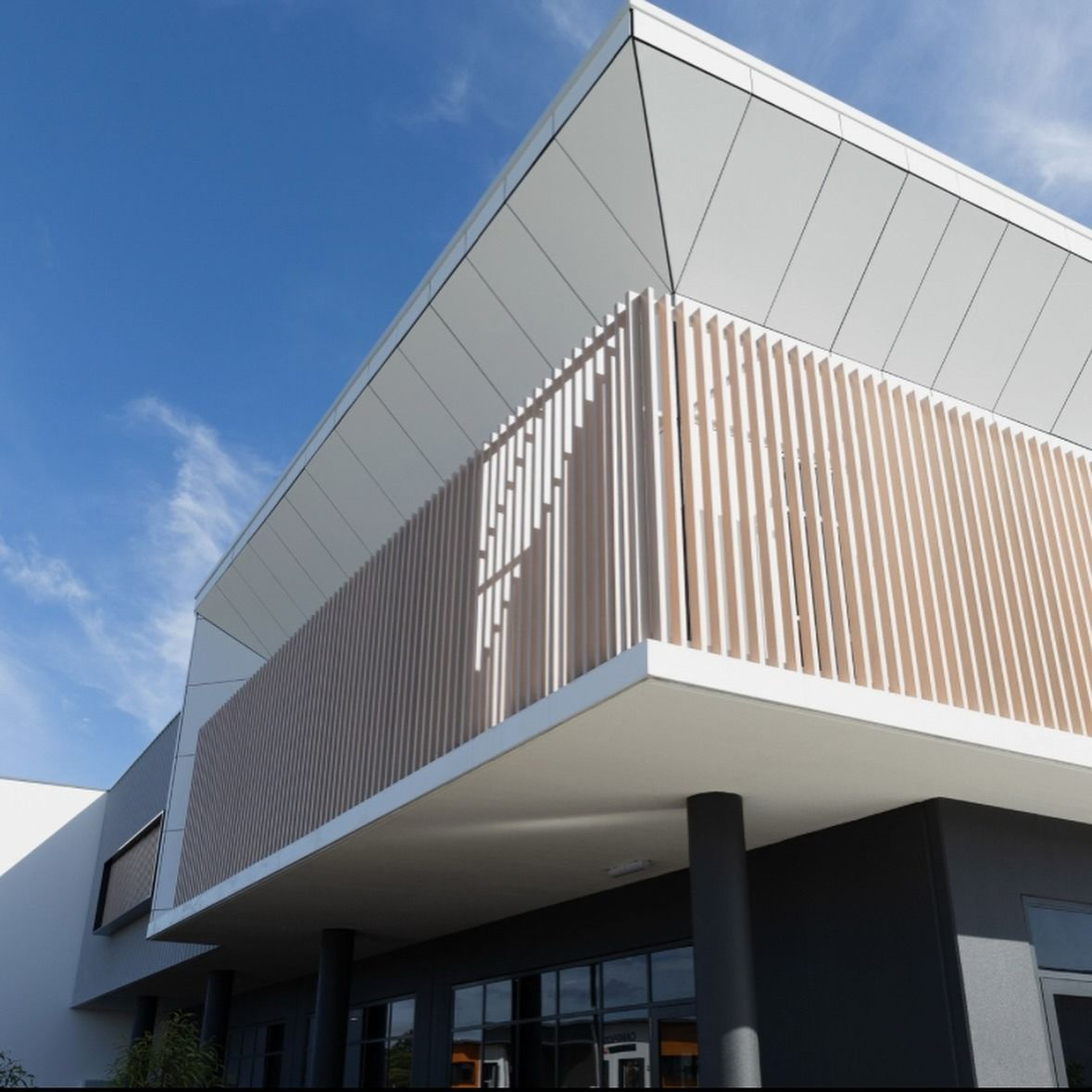 Low-Angle View of a Modern Building With White Angular Rooflines — Reynolds Built In Currimundi, QLD
