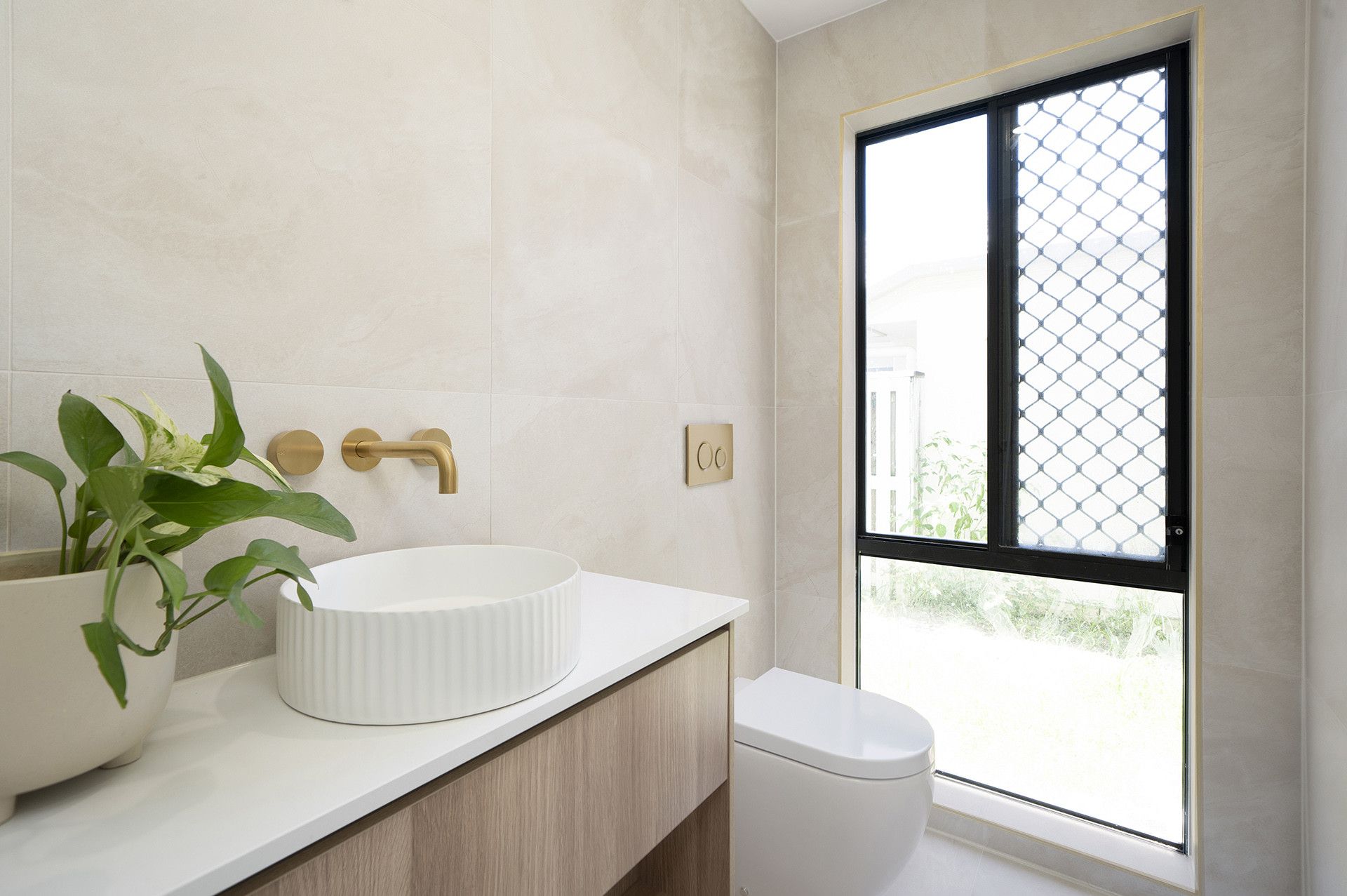 Modern Bathroom With a White Vessel Sink, Gold Wall-mounted Faucet — Reynolds Built In Moffat Beach, QLD