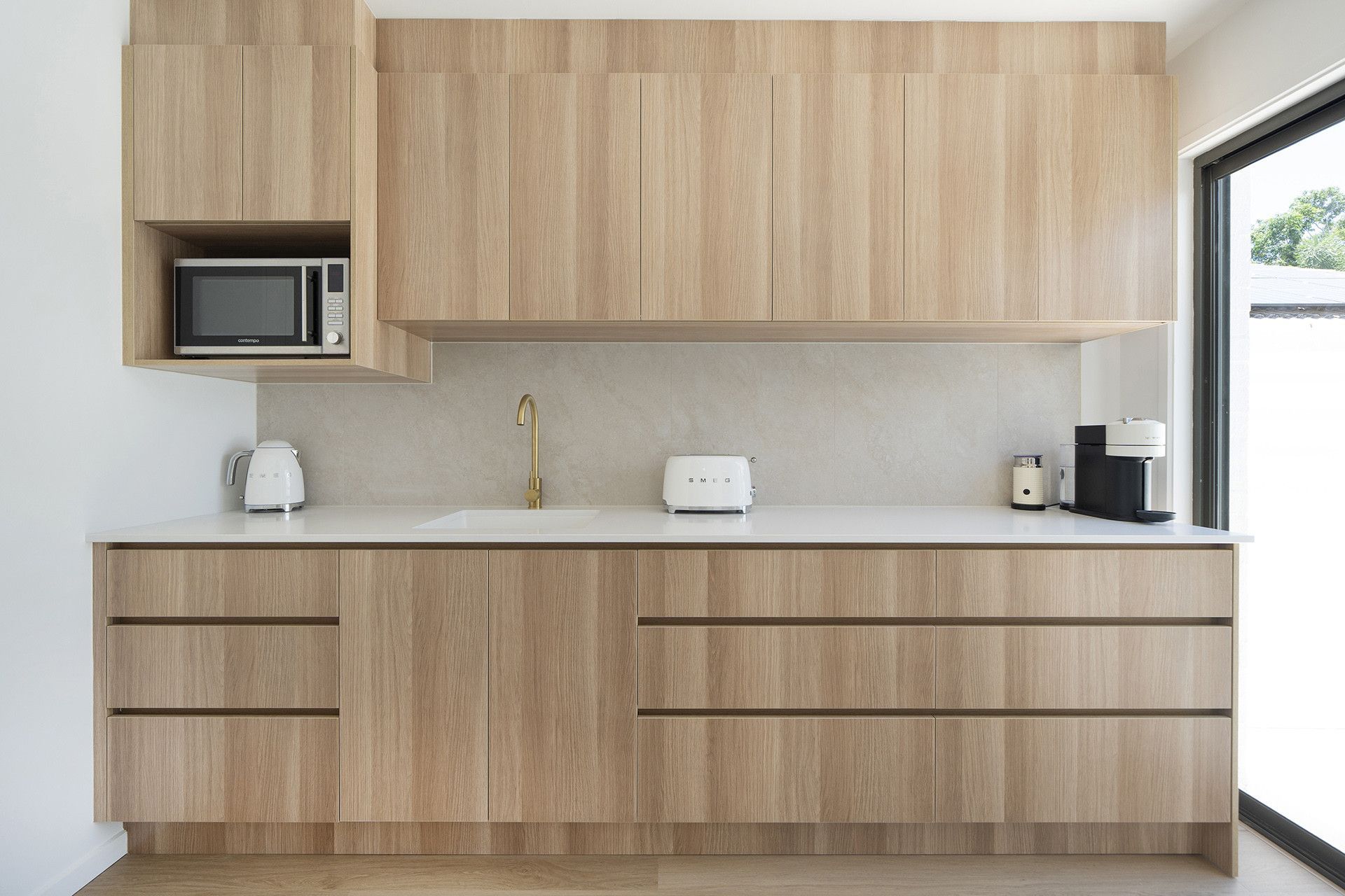 A Kitchen With A Sink And A Large Window — Reynolds Built In Moffat Beach, QLD