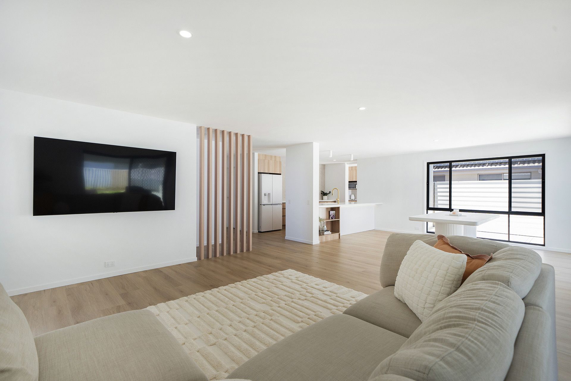 A Bright, Modern Living Room With White Walls — Reynolds Built In Maroochydore, QLD