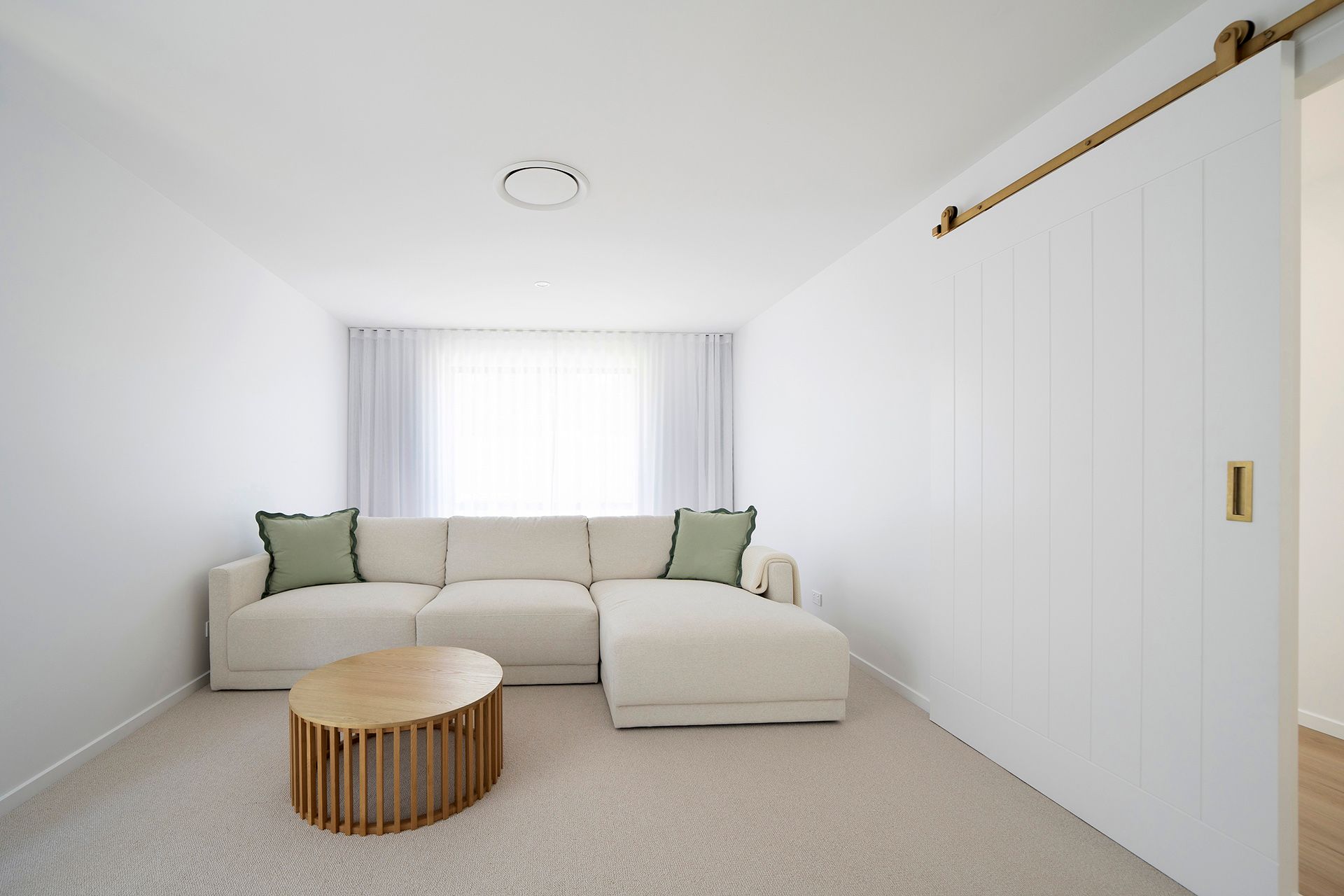 Minimalist White Living Room With Beige Sectional Sofa — Reynolds Built In Mooloolaba, QLD