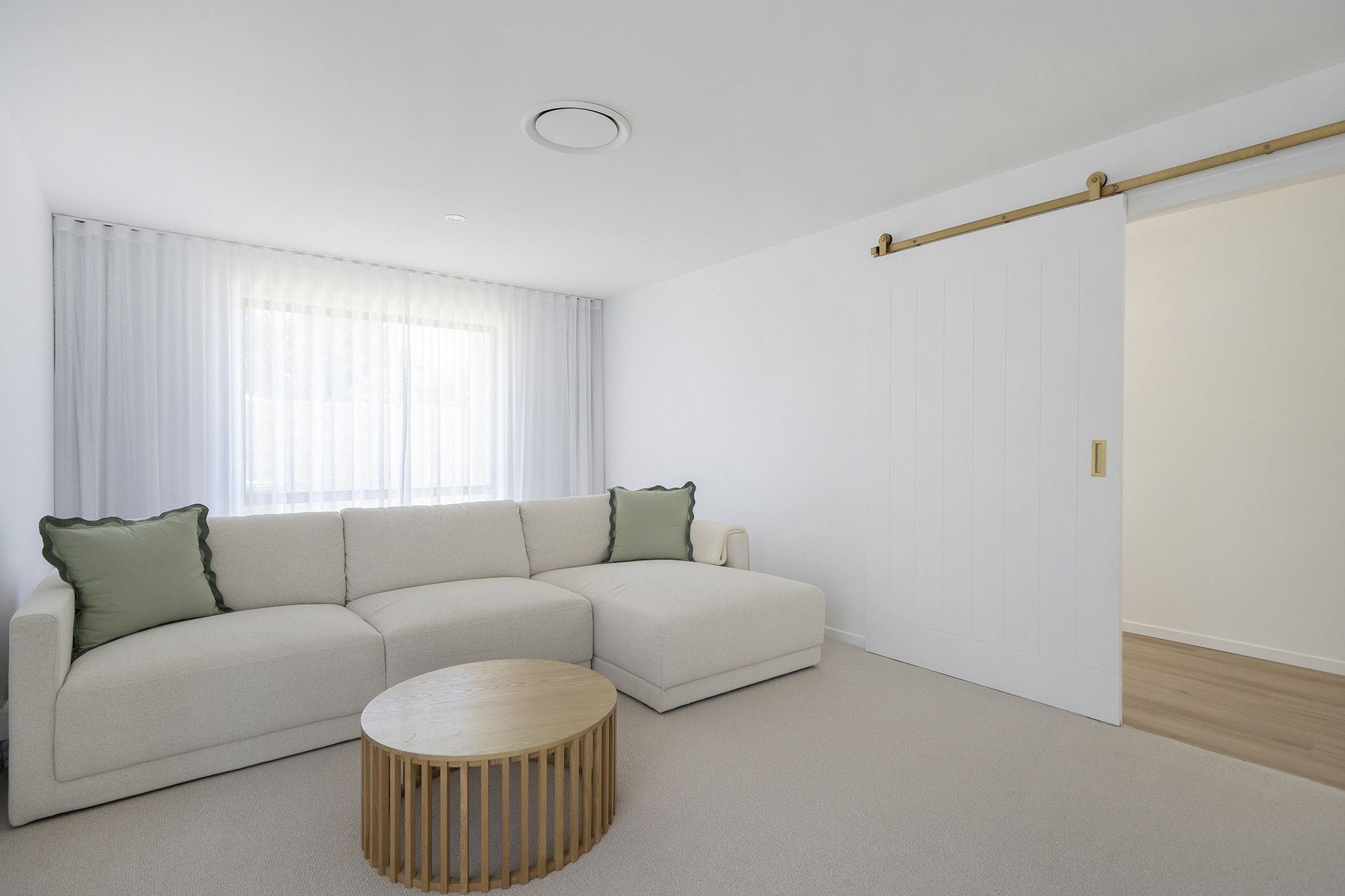 A Bright Living Room With a Beige Sectional Sofa — Reynolds Built In Currimundi, QLD