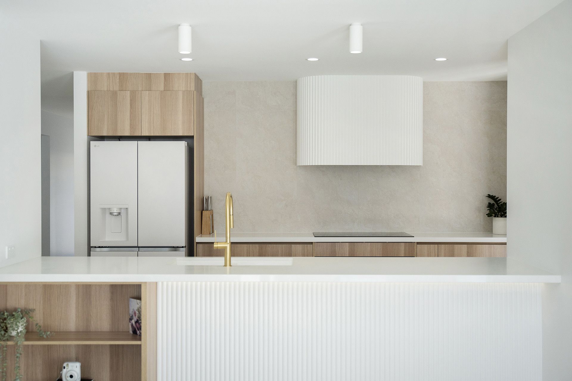 A Modern, Minimalist Kitchen With Light Wood Cabinets — Reynolds Built In Maroochydore, QLD