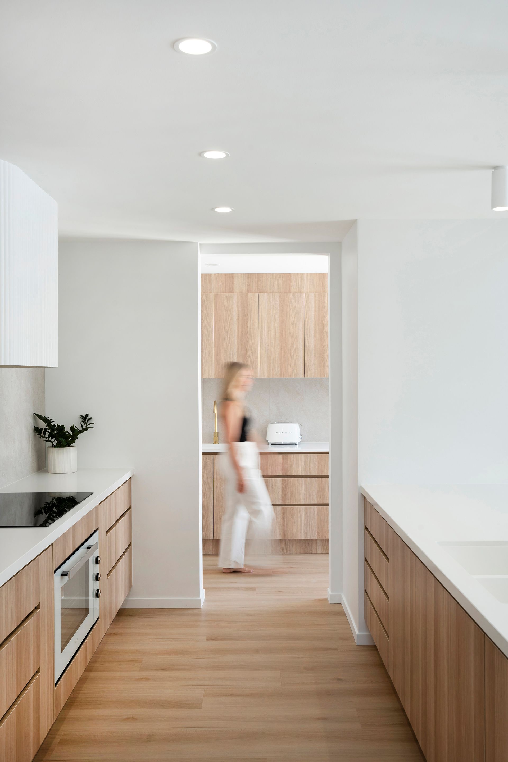 A Kitchen With A Large Island And Wooden Cabinets — Reynolds Built In Currimundi, QLD