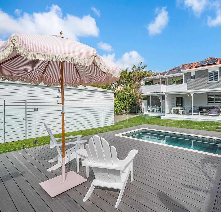 Backyard Deck With White Lounge Chairs, Striped Umbrella — Reynolds Built In Moffat Beach, QLD