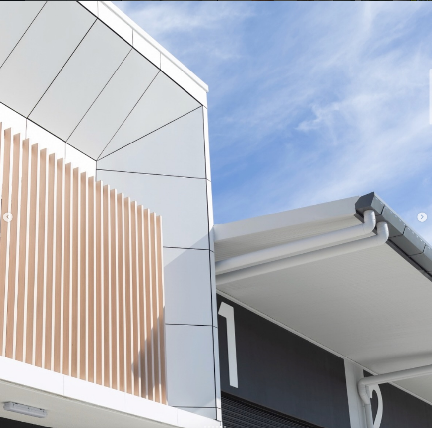 Modern Industrial Building Exterior With Wood-slat Paneling — Reynolds Built In Maroochydore, QLD