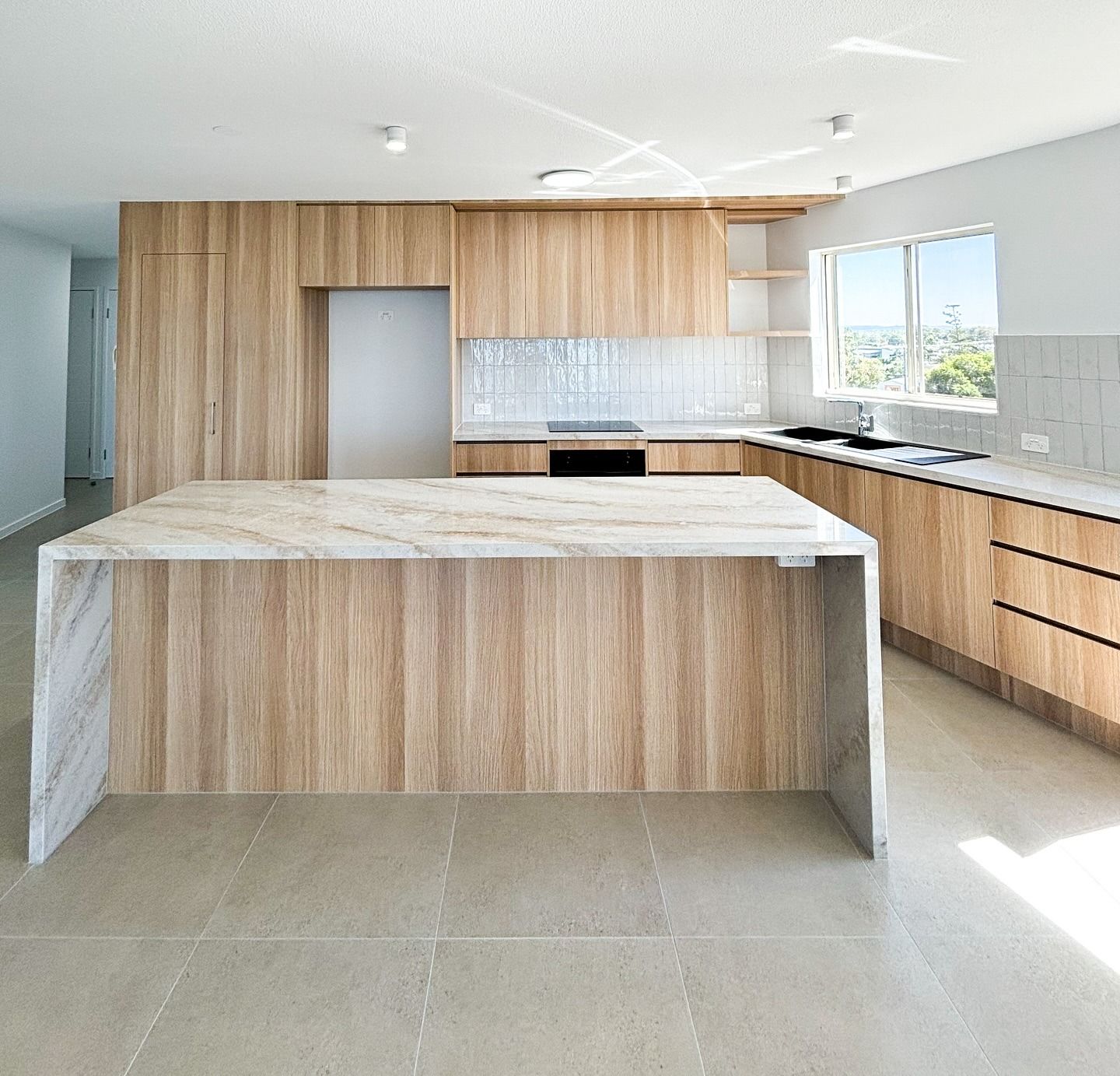Modern Kitchen With Light Wood Cabinets, Large Island — Reynolds Built In Currimundi, QLD
