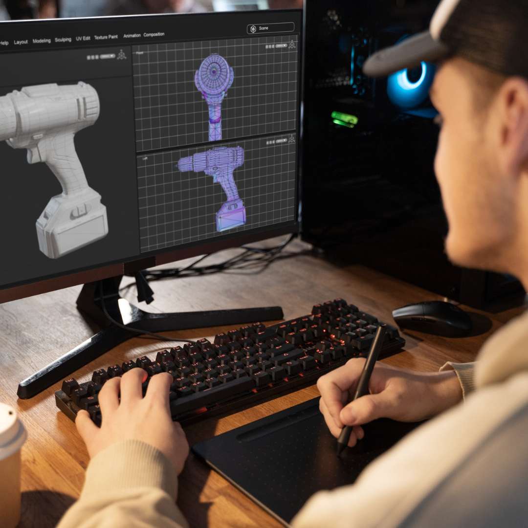 Designer modelling a cordless drill in 3D on a workstation.