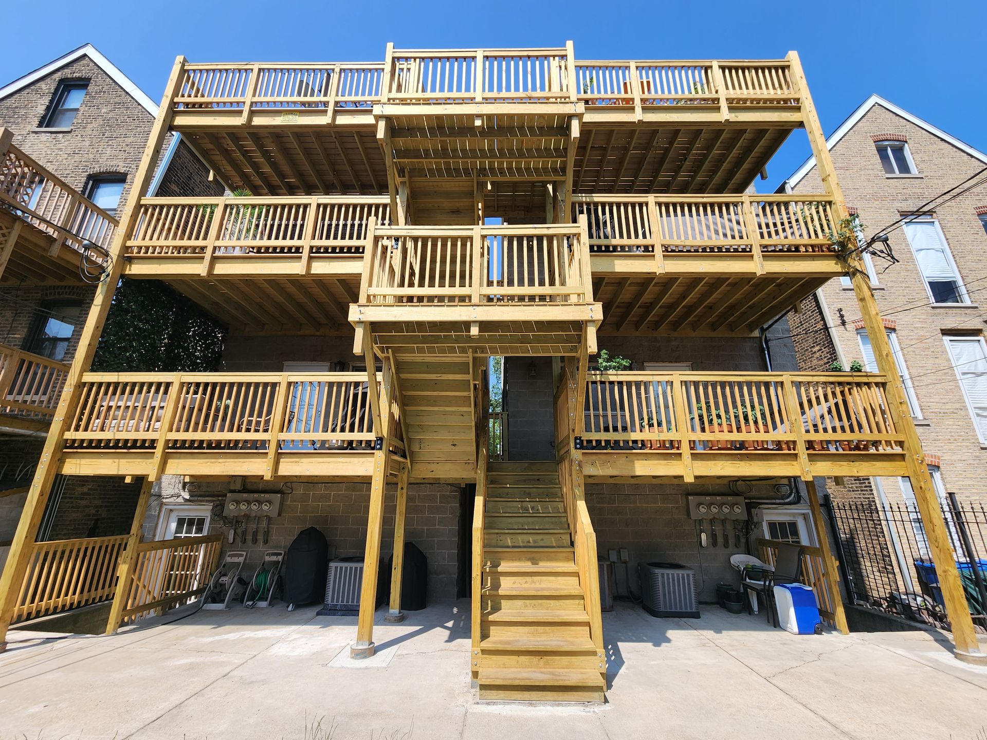 A building with a lot of wooden decks and stairs.