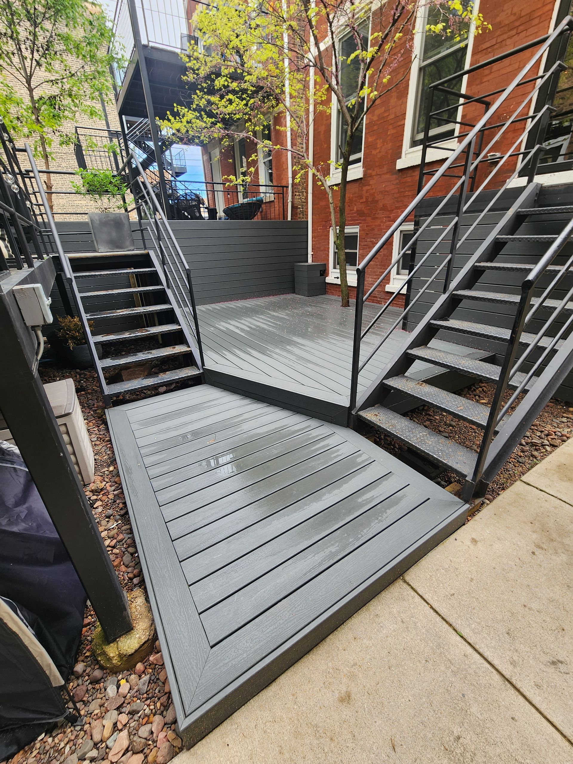 A set of stairs leading up to a brick building.
