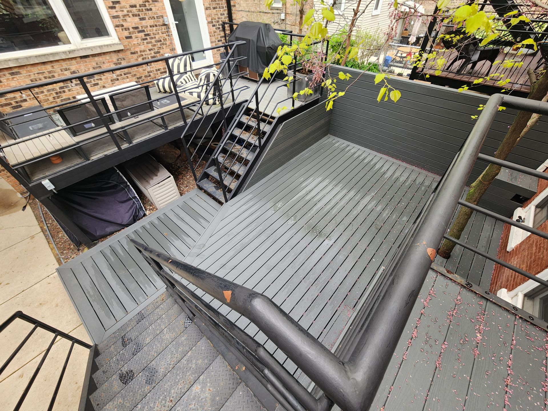 A wooden deck with stairs leading up to it.